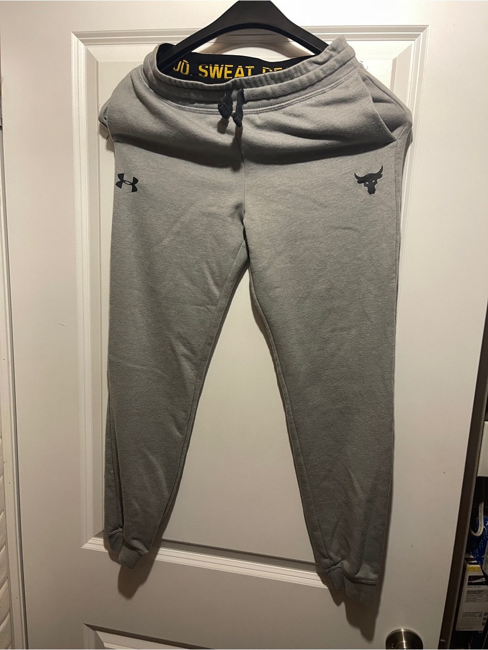 Under Armour Gray Fleece Sweatpants with Black Waistband and Yellow Text